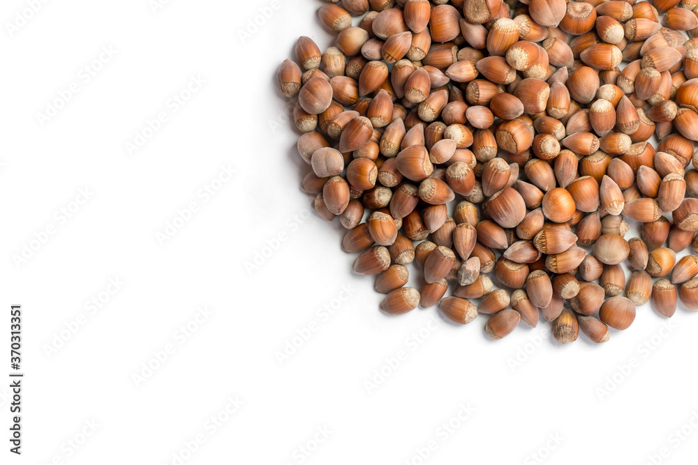 raw hazelnuts on white background raw hazelnuts on white background