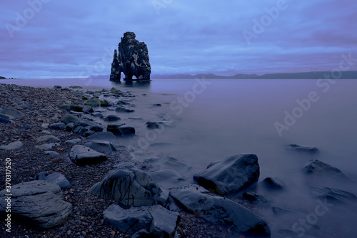 Hvítserkur, basalt steep rock like a dragon or rhinoceros drinking water in northern iceland photo