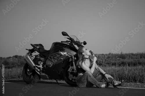 Beautiful woman with a motorcycle