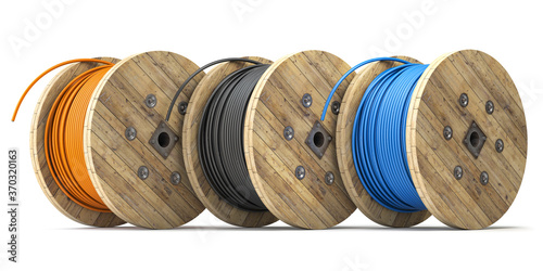 Wire electric cable of different colors on wooden coil or spool isolated on white background.