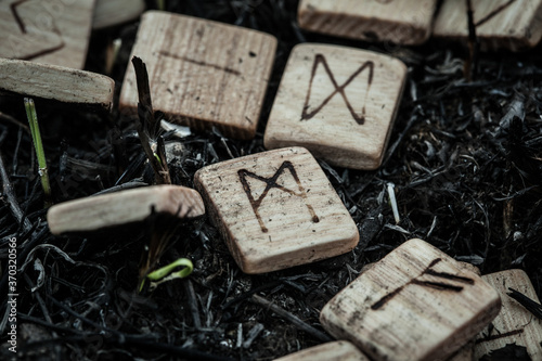 wooden runes on the ground photo