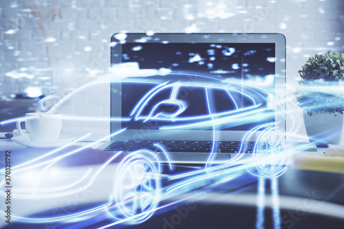 Desktop computer background in office with automobile hologram drawing. Multi exposure. Tech concept.