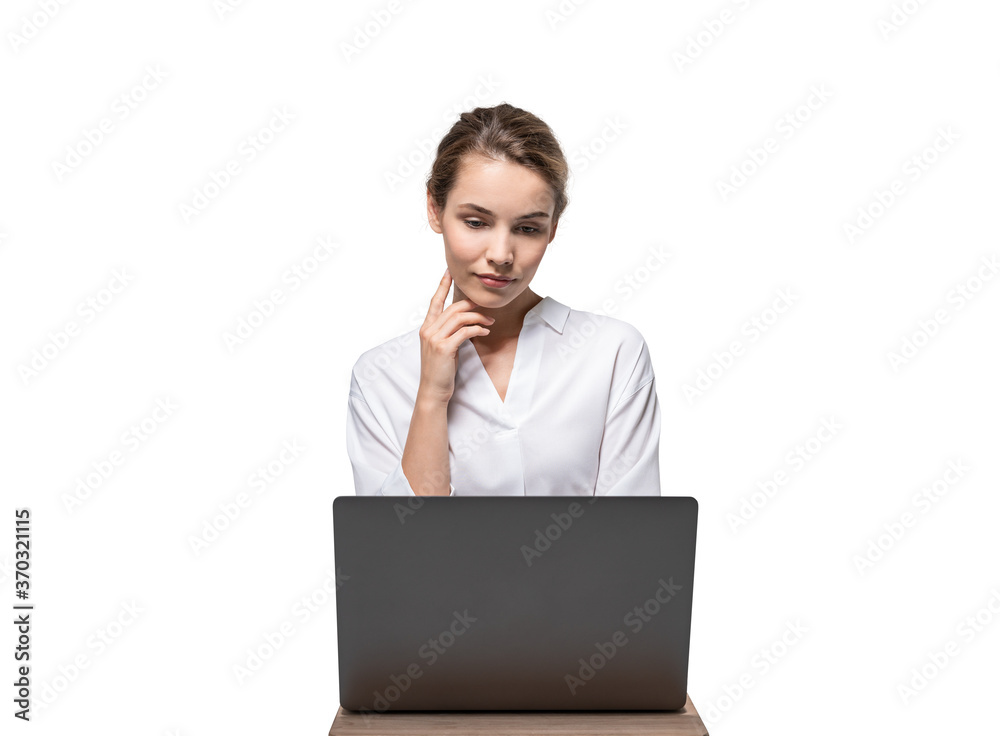 Serious businesswoman using laptop, isolated Serious businesswoman using laptop, isolated