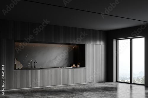 Cabinets in black marble kitchen corner © ImageFlow