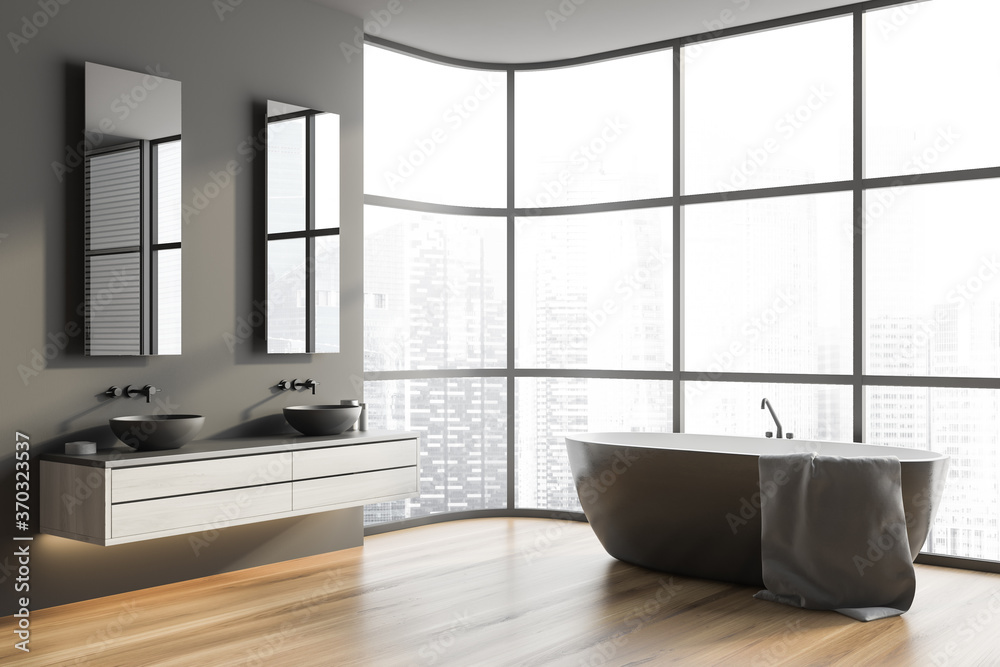 Grey bathroom corner with tub and sink Grey bathroom corner with tub and sink