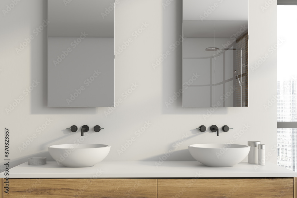 Fototapeta premium Two round sinks in white bathroom