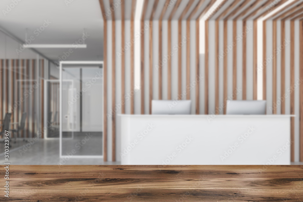 Fototapeta premium Table in blurry office with reception
