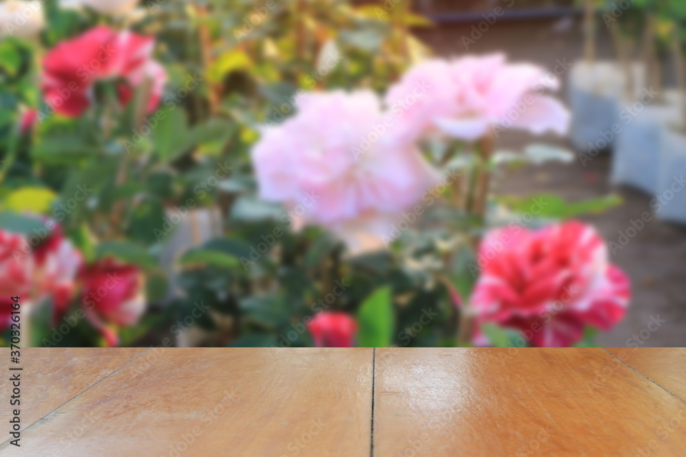 Empty wooden table background with beautiful roses for background. Empty wooden table background with beautiful roses for background.