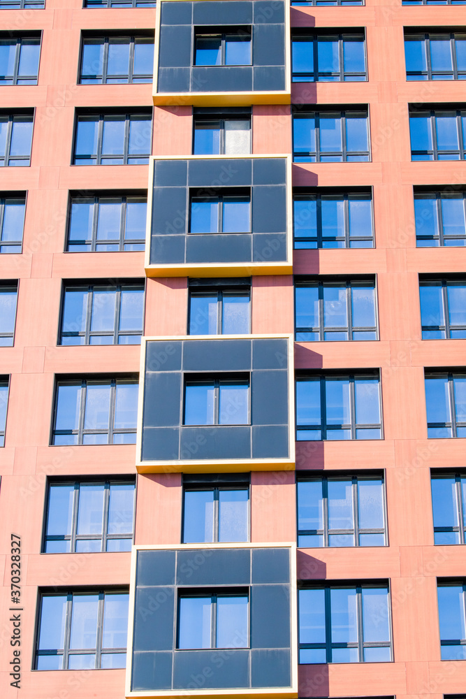 Exterior of modern architecture in the city center. Construction abstract background. Detail of the facade with windows.