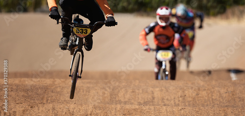 BMX riders competing in the child class on the off-road circuit