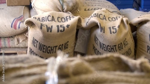Arabica coffee beans in bags - coffee storing in roasting company