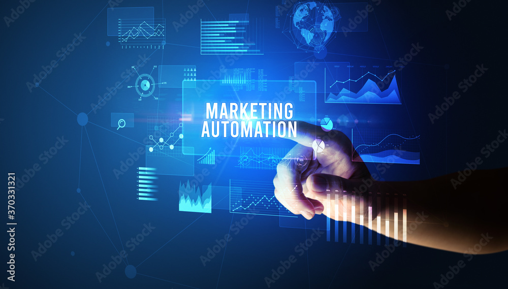Hand touching MARKETING AUTOMATION inscription, new business technology concept Hand touching MARKETING AUTOMATION inscription, new business technology concept