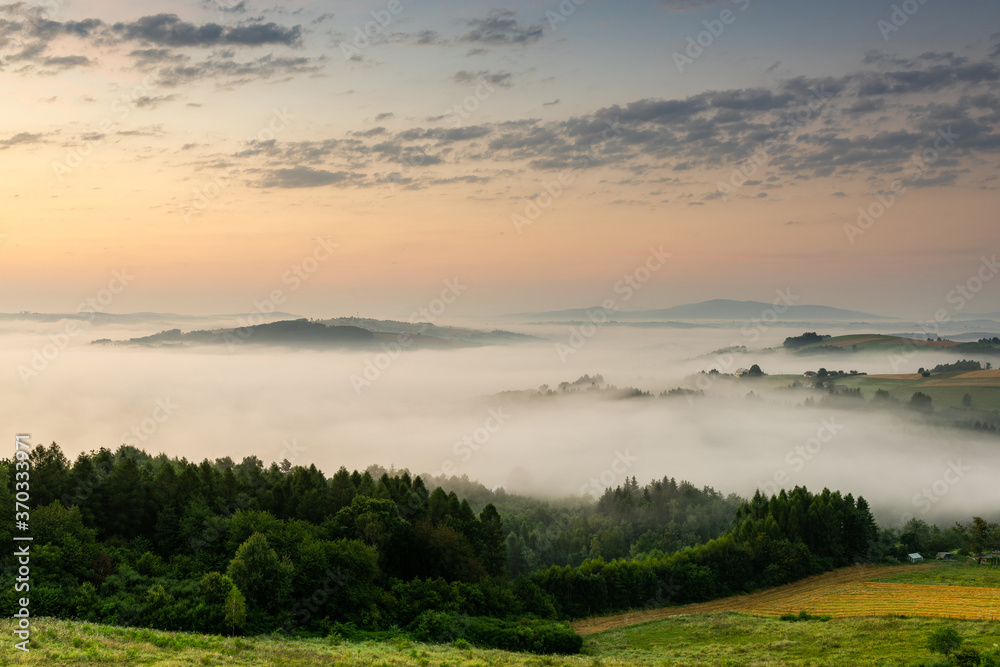 Hills in Morning Fog at Sunrise in Lesser Poland