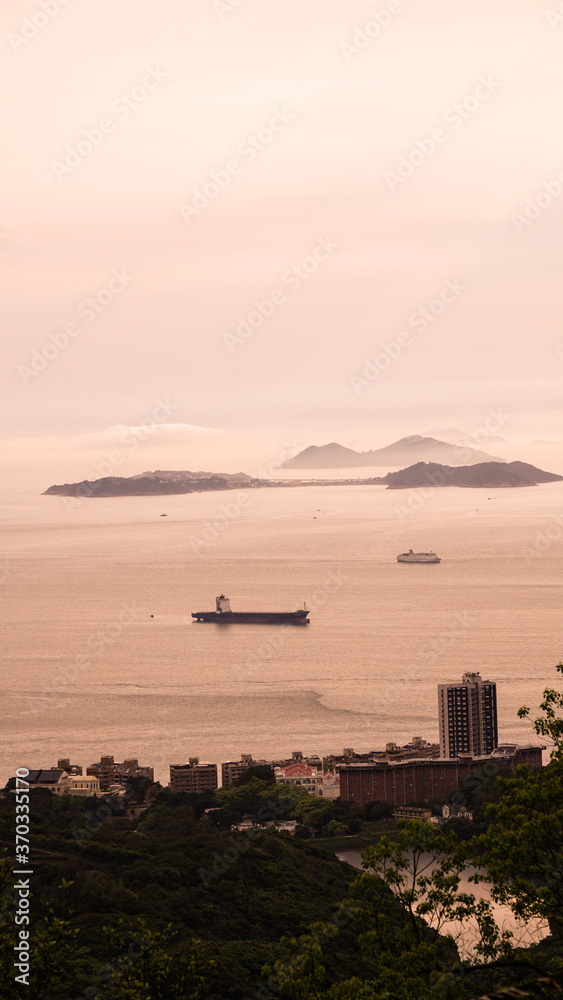Hong Kong ocean sunset mountain heaven background nautical vessel cargo ship industry