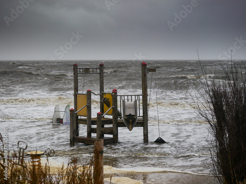 Ueberschwemmung auf einem Spielplatz nach Herbststurm am Strand von Sahlenburg Cuxhaven  photo