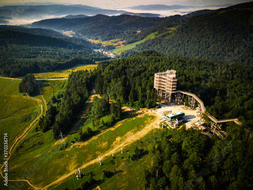 Fototapeta Naklejka Na Ścianę i Meble -  Slotwiny Arena Lookout Tower. Wooden Observation Tower in Lesser Poland.Drone View.