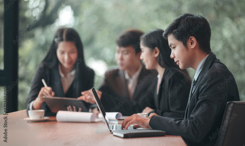 Young business people working together in modern office. Young business people working together in modern office.