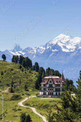 The Pro Nature Center for the Great Aletsch Glacier region - the Villa Cassel in summer with Matterhorn peak at the background. The building was built in 1902 in Victorian architecture style. photo