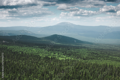 Wild national Park in the middle of Russia, in the Urals. View of endless deciduous and coniferous forests. Tourism and environment concept