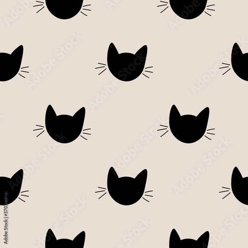 Seamless pattern with cute cat muzzles. Animal polka dot background. Feline wrapping paper. Vector illustration. 