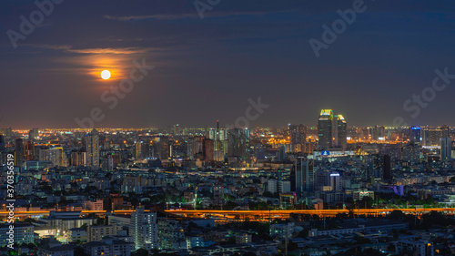 Beautiful aerial cityscape view of Bangkok city at night and full moon
