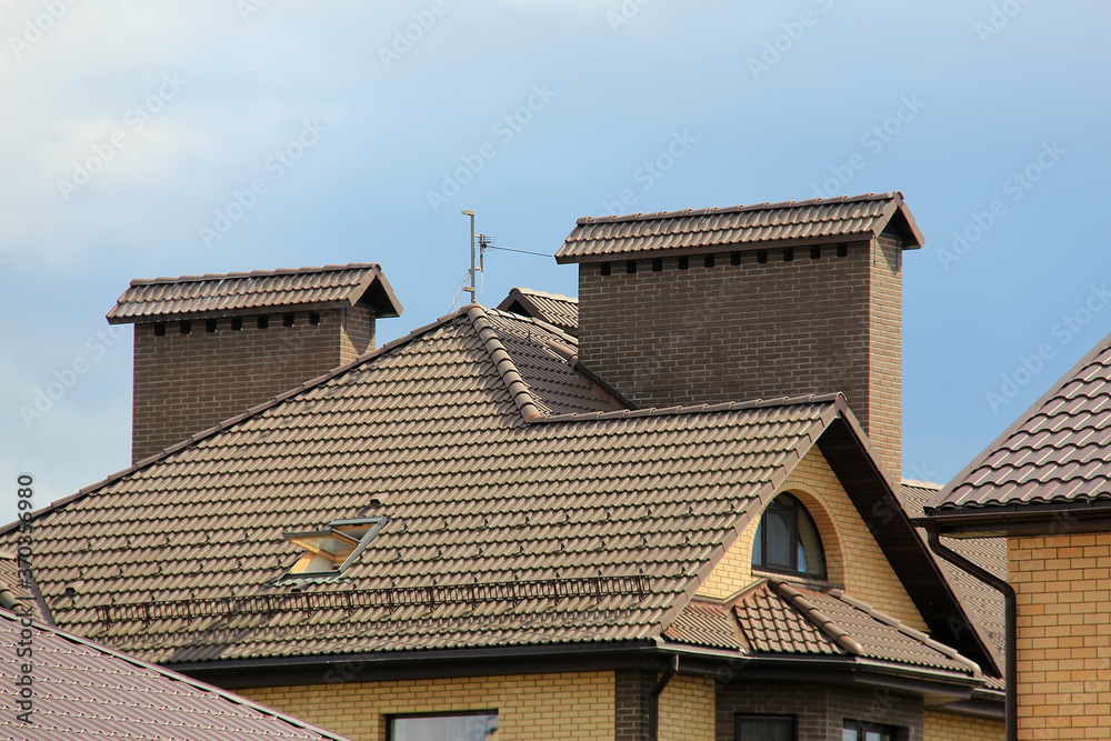 icon roof with new brown roofing tiles on residential property. banner