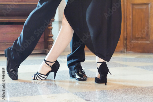 Legs of man and woman dancing Argentine tango