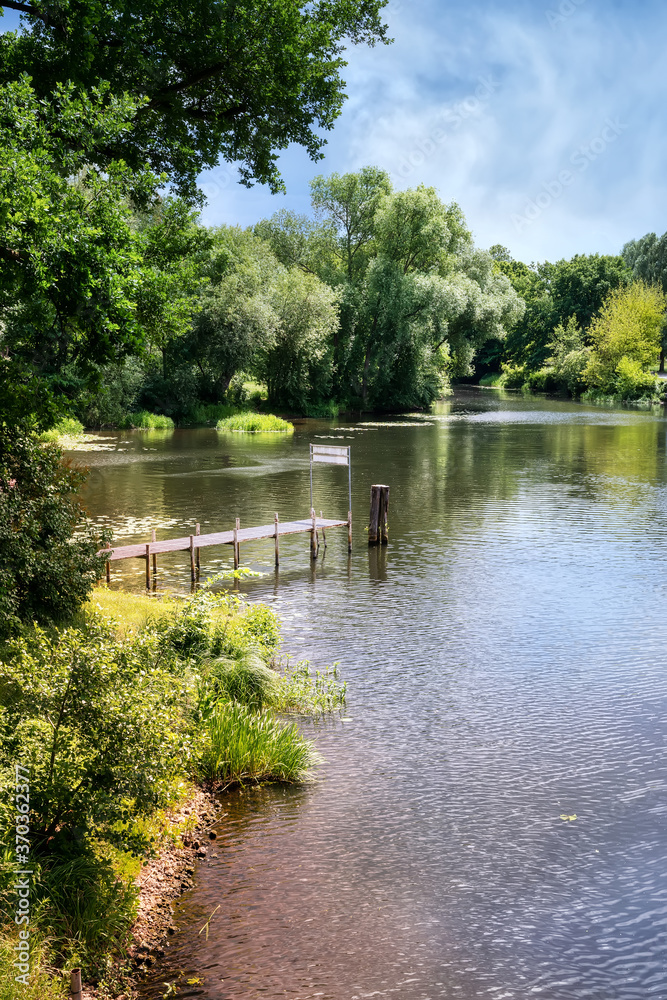 Obraz premium Landscape in Oranienburg with havel river and bank in beautiful sunshine