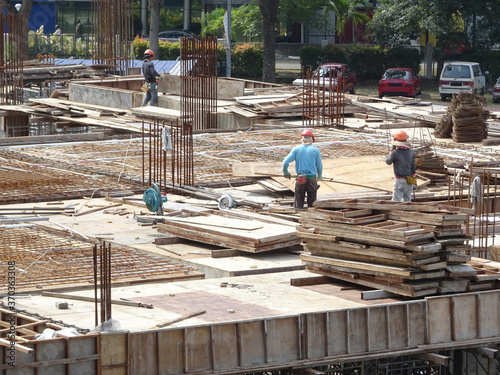 KUALA LUMPUR, MALAYSIA -MARCH 7, 2020:The construction site is operating during the day. Workers are busy carrying out their activities as planned under the supervisor's supervision.