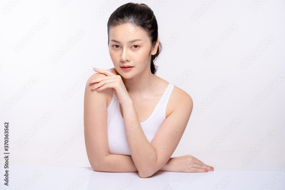 Beautiful young woman with clean fresh skin . She holds an apple. Facial treatment . Cosmetology , beauty and spa . Skin care Beautiful young woman with clean fresh skin . She holds an apple. Facial treatment . Cosmetology , beauty and spa . Skin care