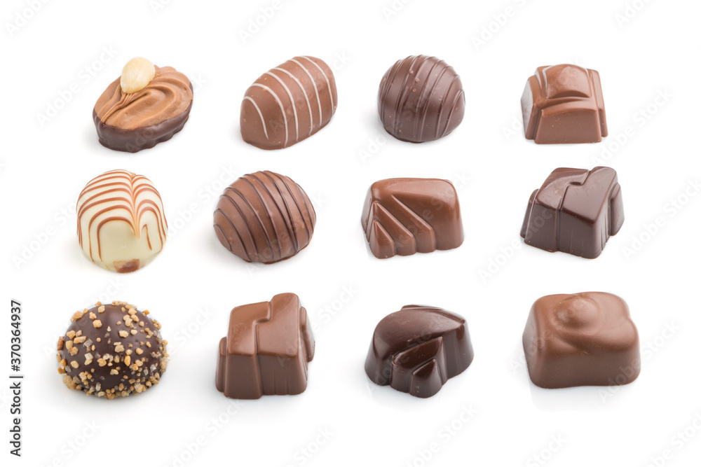 Different chocolate candies isolated on white background. side view.