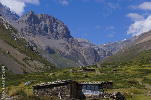 Two small Nepali meadow huts on the Annapurna circuit close to Yak Kharka. photo