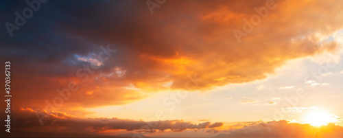 Beautiful bright sunset sky. Dramatic colorful clouds after sunset. Nature, sunset clouds backgrounds. © Inga Av