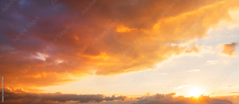 Beautiful bright sunset sky. Dramatic colorful clouds after sunset. Nature, sunset clouds backgrounds.