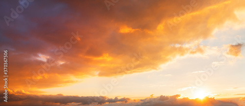 Beautiful bright sunset sky. Dramatic colorful clouds after sunset. Nature  sunset clouds backgrounds.