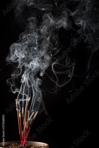 Fototapeta Naklejka Na Ścianę i Meble -  Abstract concept Chinese New Year graphic element incense burning