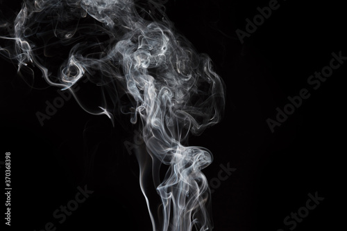 Fototapeta Naklejka Na Ścianę i Meble -  Smoke isolated on black background. Movement of white smoke