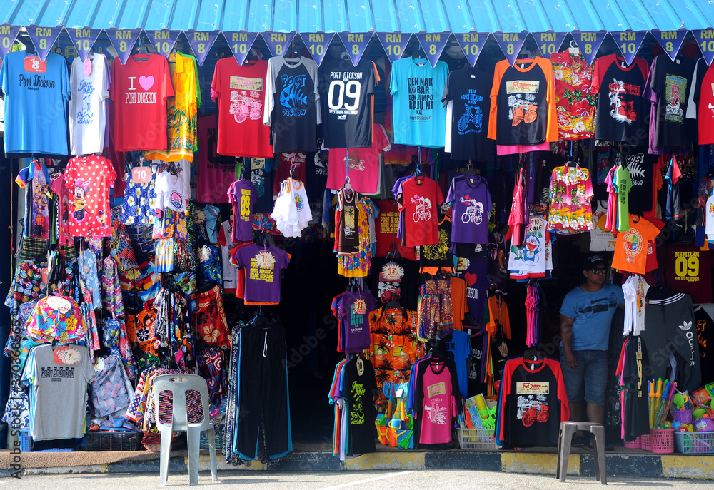 Fototapeta premium PORT DICKSON, MALAYSIA -MARCH 3, 2020: Clothes for sale, hung in front of the store to attract customers. There are a variety of attractive sizes and designs. 