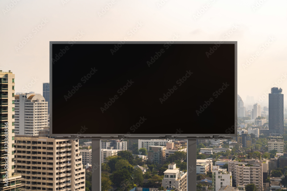 Blank black road billboard with Bangkok cityscape background at day time. Street advertising poster, mock up, 3D rendering. Front view. The concept of marketing communication to promote or sell idea. Blank black road billboard with Bangkok cityscape background at day time. Street advertising poster, mock up, 3D rendering. Front view. The concept of marketing communication to promote or sell idea.