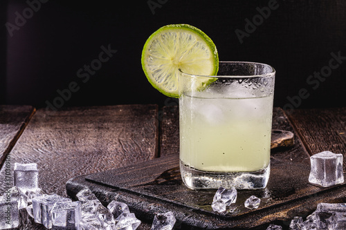 Brazilian Caipirinha, typical Brazilian cocktail made with lemon, cachaça and sugar. international caipirinha day, symbol drink of brazil. photo