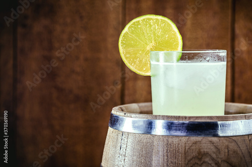 Brazilian Caipirinha, typical Brazilian cocktail made with lemon, cachaça and sugar. Traditional drink from Brazil, isolated with space for text photo