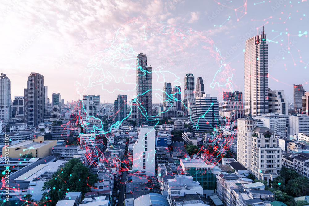 Obraz premium Glowing hologram of Earth planet map on aerial panoramic cityscape of Bangkok at sunset, Asia. The concept of international business. Multi Exposure.