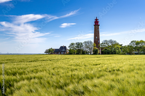 The beautiful Lighthouse Of Flügge On The Isle Of Fehmarn at the Baltic Sea in Germany. Summer in Germany.