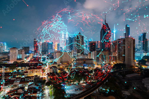 Photography Hologram of Earth planet map on night panoramic cityscape of Kuala Lumpur, Malaysia, Asia