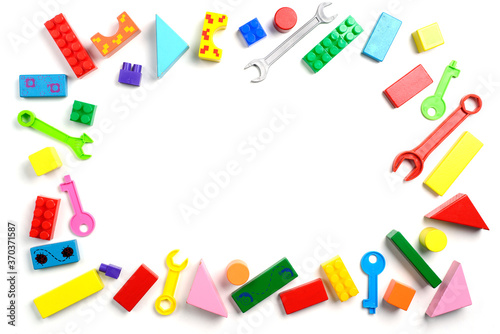 Baby toys frame. Colorful kids toys on white background. Copy space for text. Top view. Flat lay.