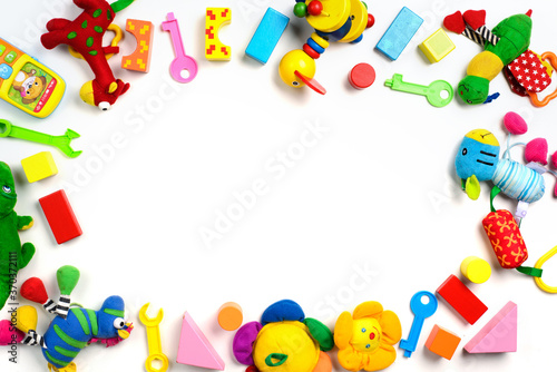 Baby toys frame. Colorful kids toys on white background. Copy space for text. Top view. Flat lay.