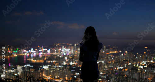 Woman enjoy the city view under sunset