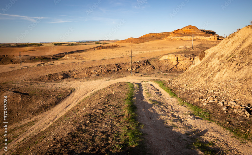 summer landscape with agricultural plowed fields next to San Esteban de Gormaz, province of Soria, Castile and Leon, Spain summer landscape with agricultural plowed fields next to San Esteban de Gormaz, province of Soria, Castile and Leon, Spain