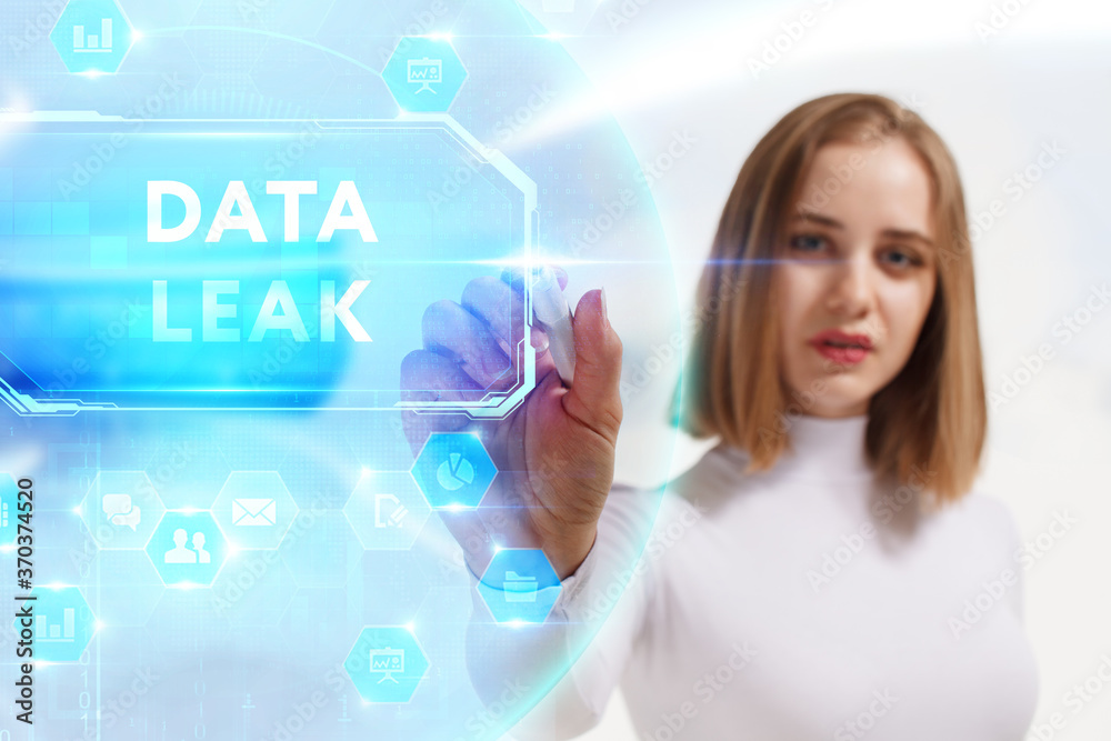 Business, Technology, Internet and network concept. Young businessman working on a virtual screen of the future and sees the inscription: Data leak Business, Technology, Internet and network concept. Young businessman working on a virtual screen of the future and sees the inscription: Data leak