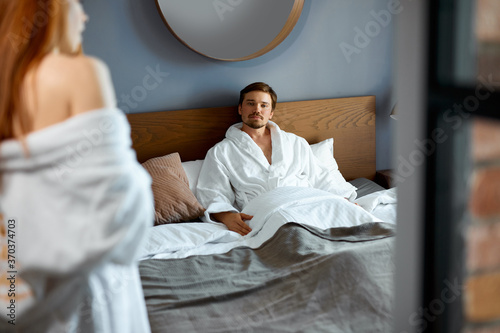 Εκτύπωση καμβά slim redhead lady and handsome guy going to make love with each other, adorable